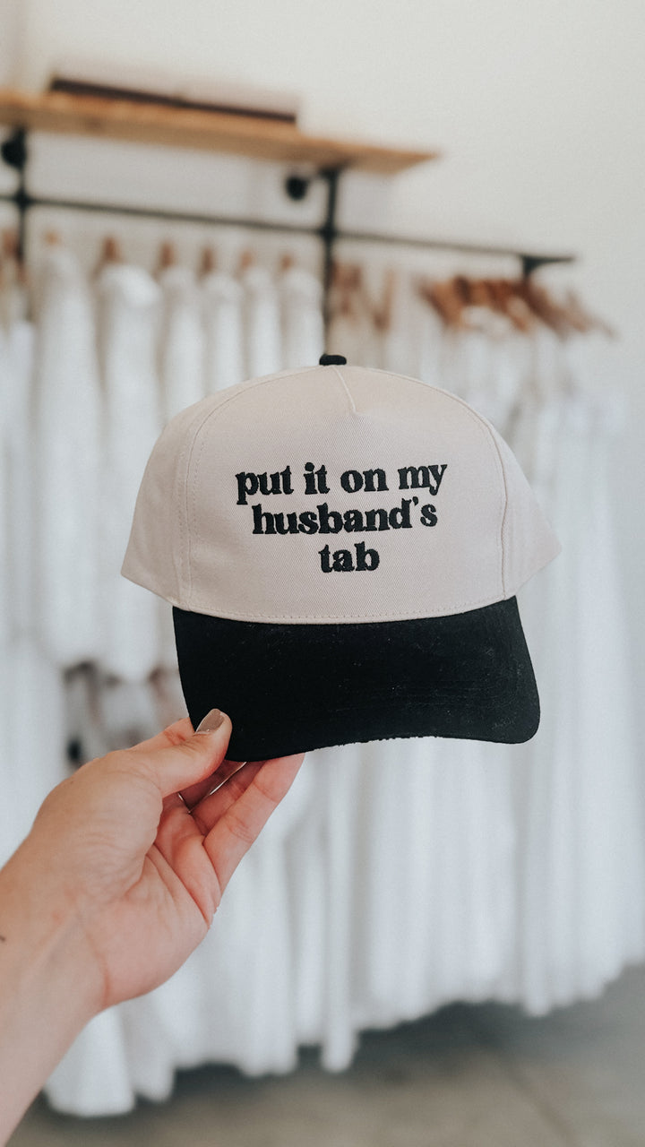 Put It On My Husband’s Tab Trucker Hat
